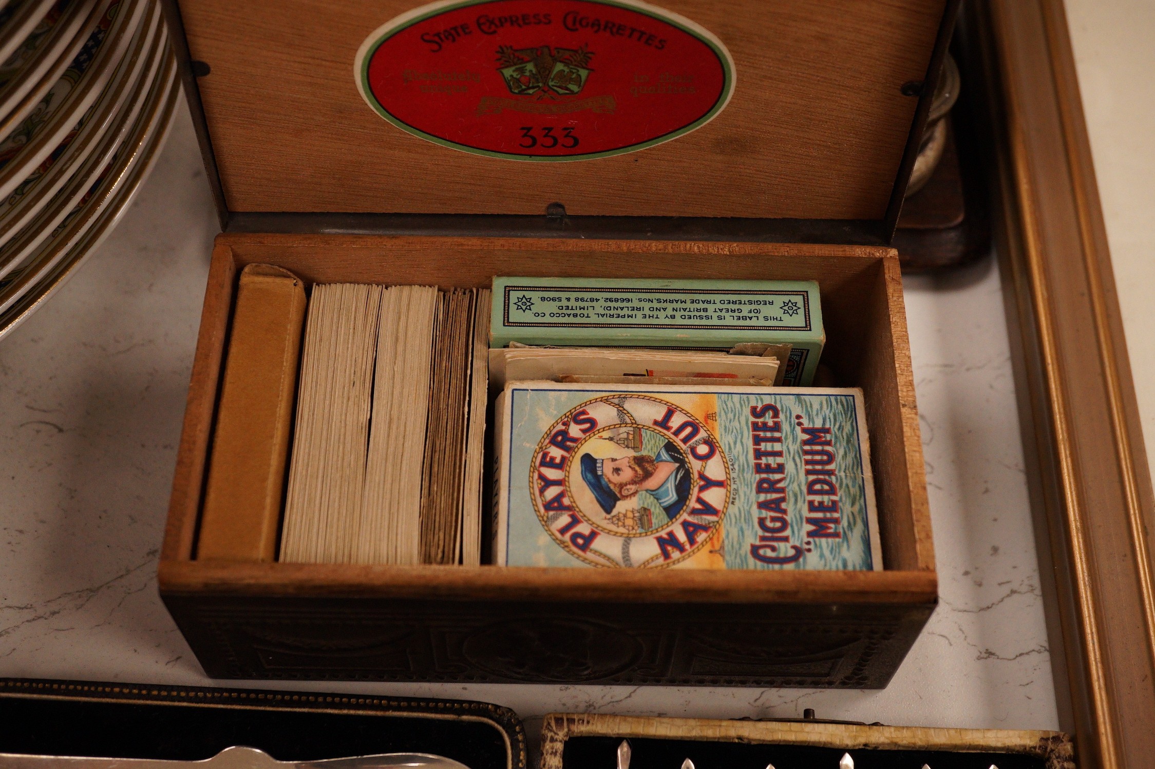 A postal scale, cased silver lobster picks, silver cocktail sticks etc